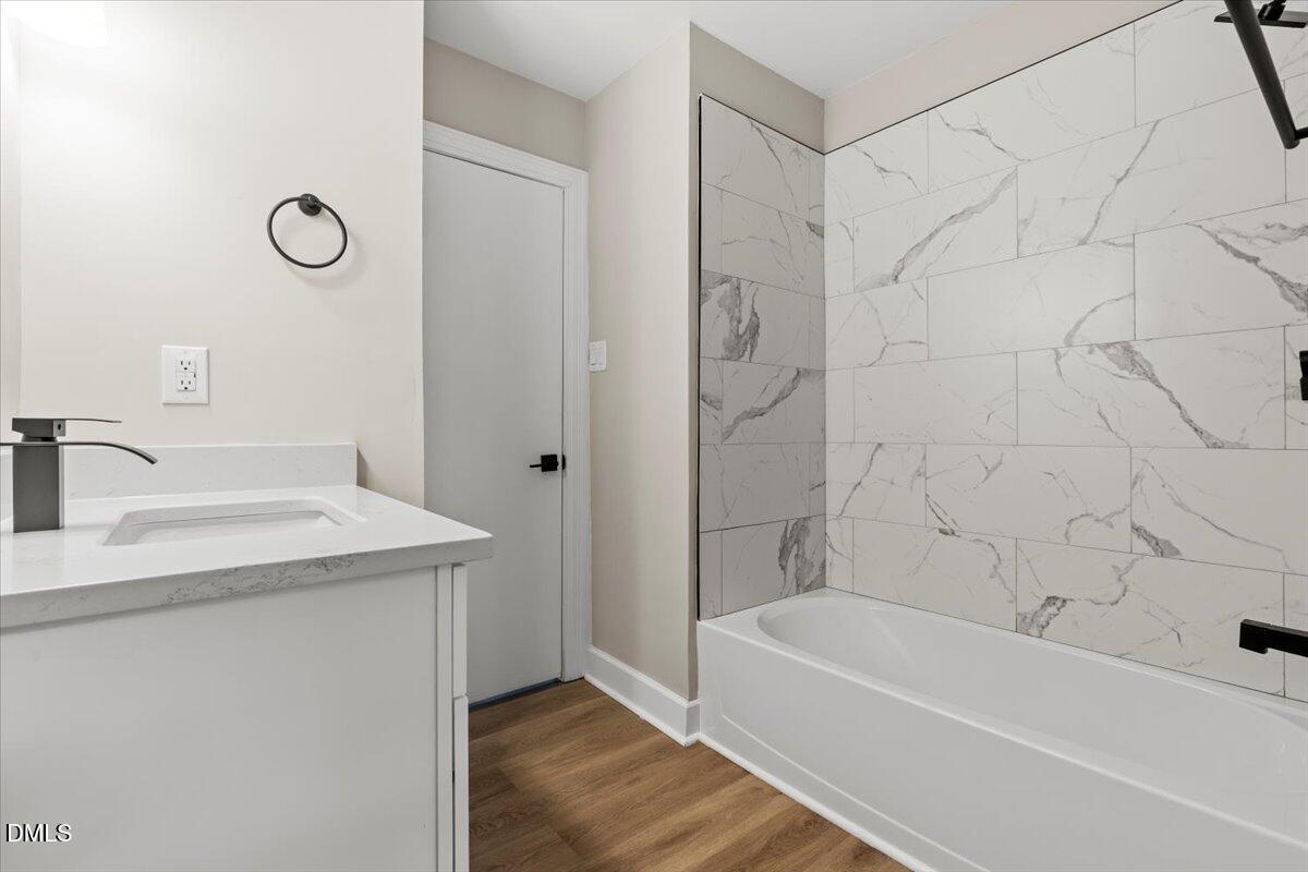 2501 Old Mill Road Rocky Mount, NC 27803 - Photo 20 of 41 a bathroom with a sink a toilet and a bathtub