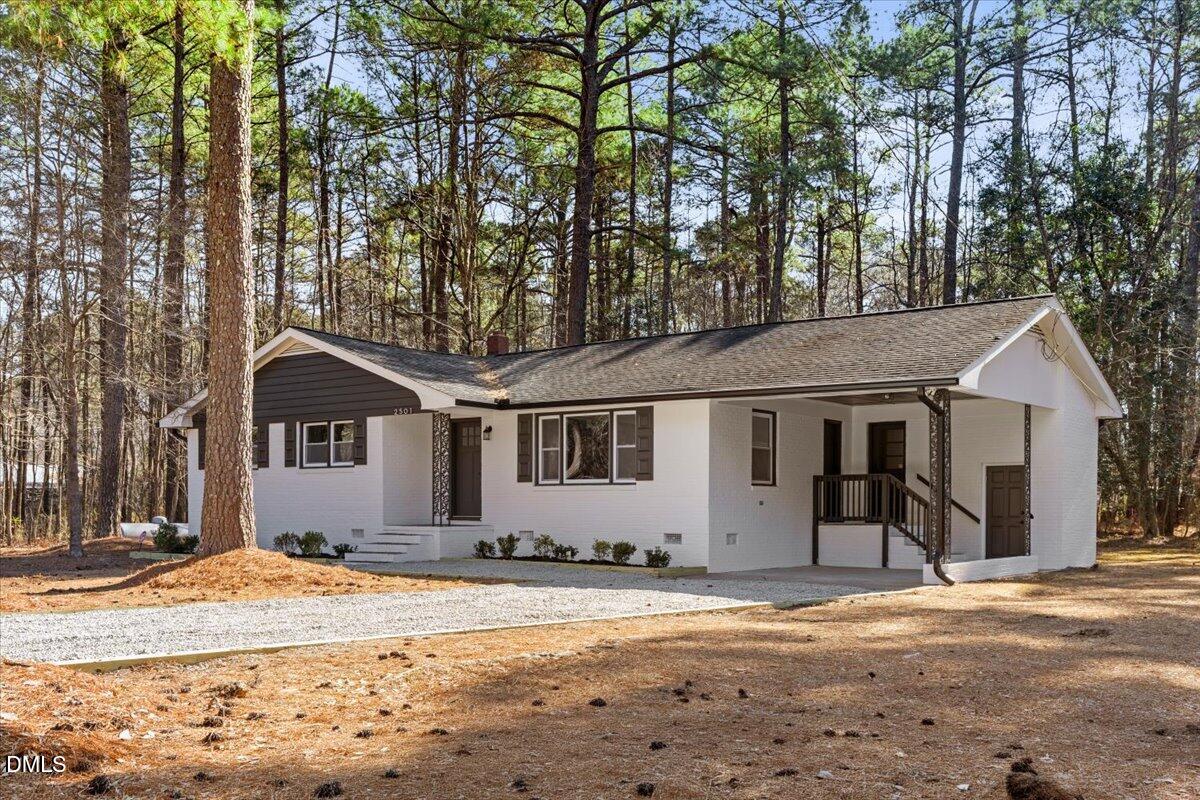 2501 Old Mill Road Rocky Mount, NC 27803 - Photo 2 of 41 a front view of a house with a yard covered in snow
