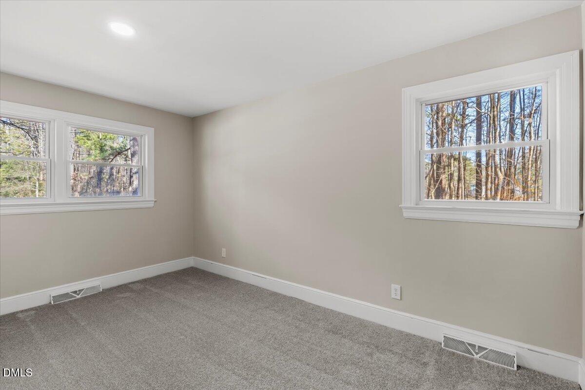 2501 Old Mill Road Rocky Mount, NC 27803 - Photo 23 of 41 an empty room with windows