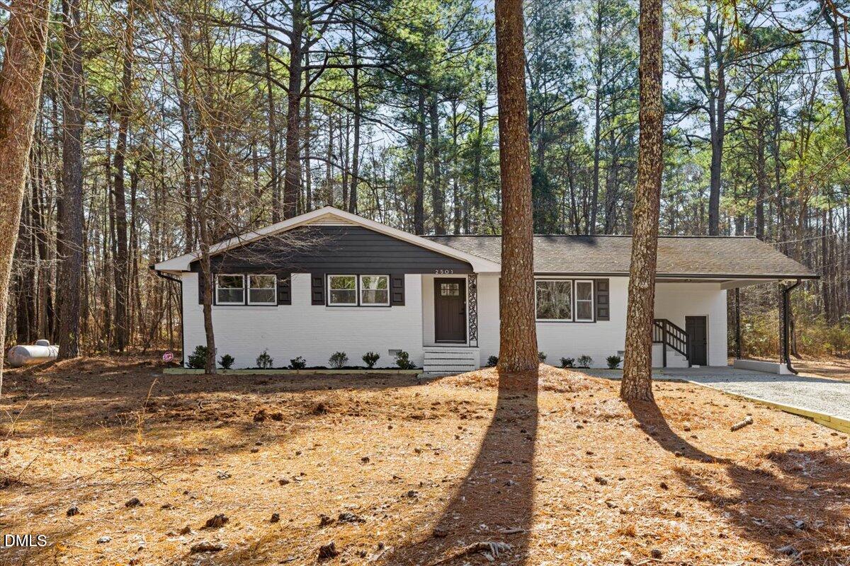 2501 Old Mill Road Rocky Mount, NC 27803 - Photo 3 of 41 a front view of a house with a yard