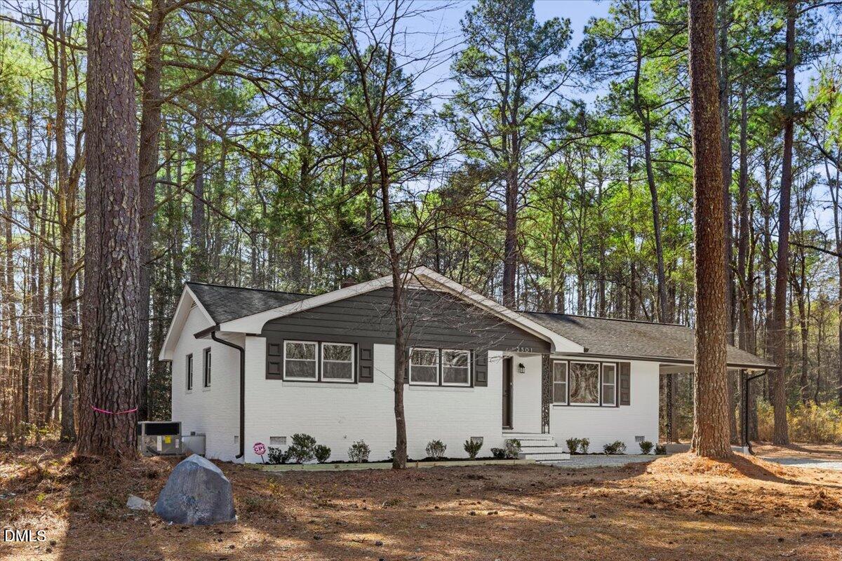 2501 Old Mill Road Rocky Mount, NC 27803 - Photo 4 of 41 a view of a house with a yard
