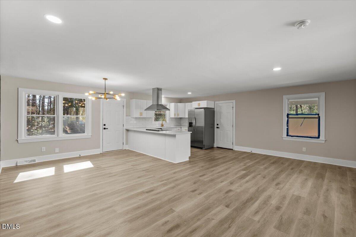 2501 Old Mill Road Rocky Mount, NC 27803 - Photo 7 of 41 a view of kitchen with wooden floor