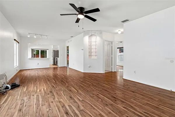 a view of an empty room and wooden floor