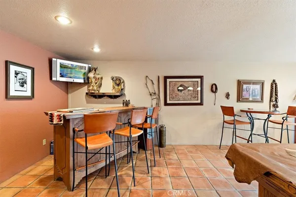 a view of a house with backyard porch and sitting area