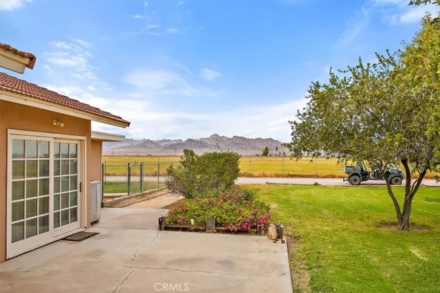 a view of a room with wooden floor and windows