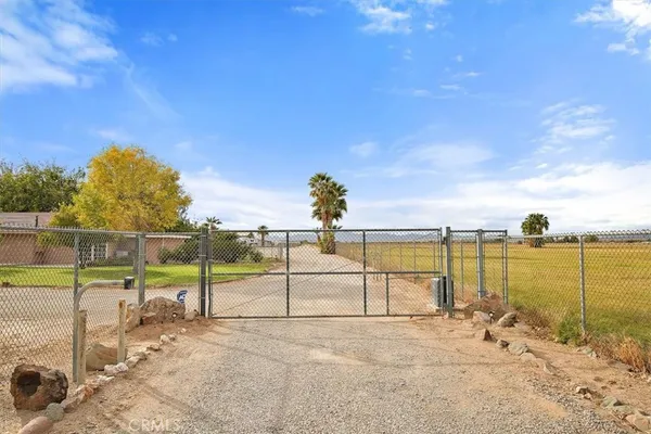 a under a large pool with lawn chairs under an umbrella