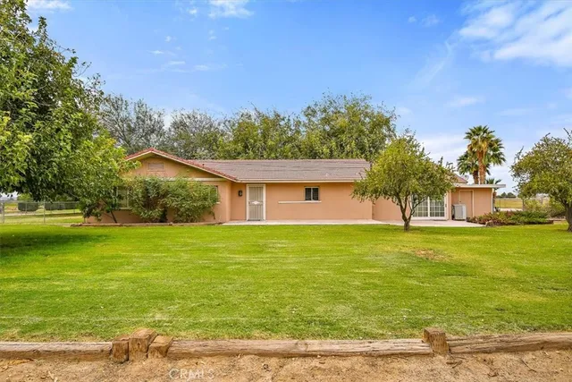 a large white kitchen with lots of appliances