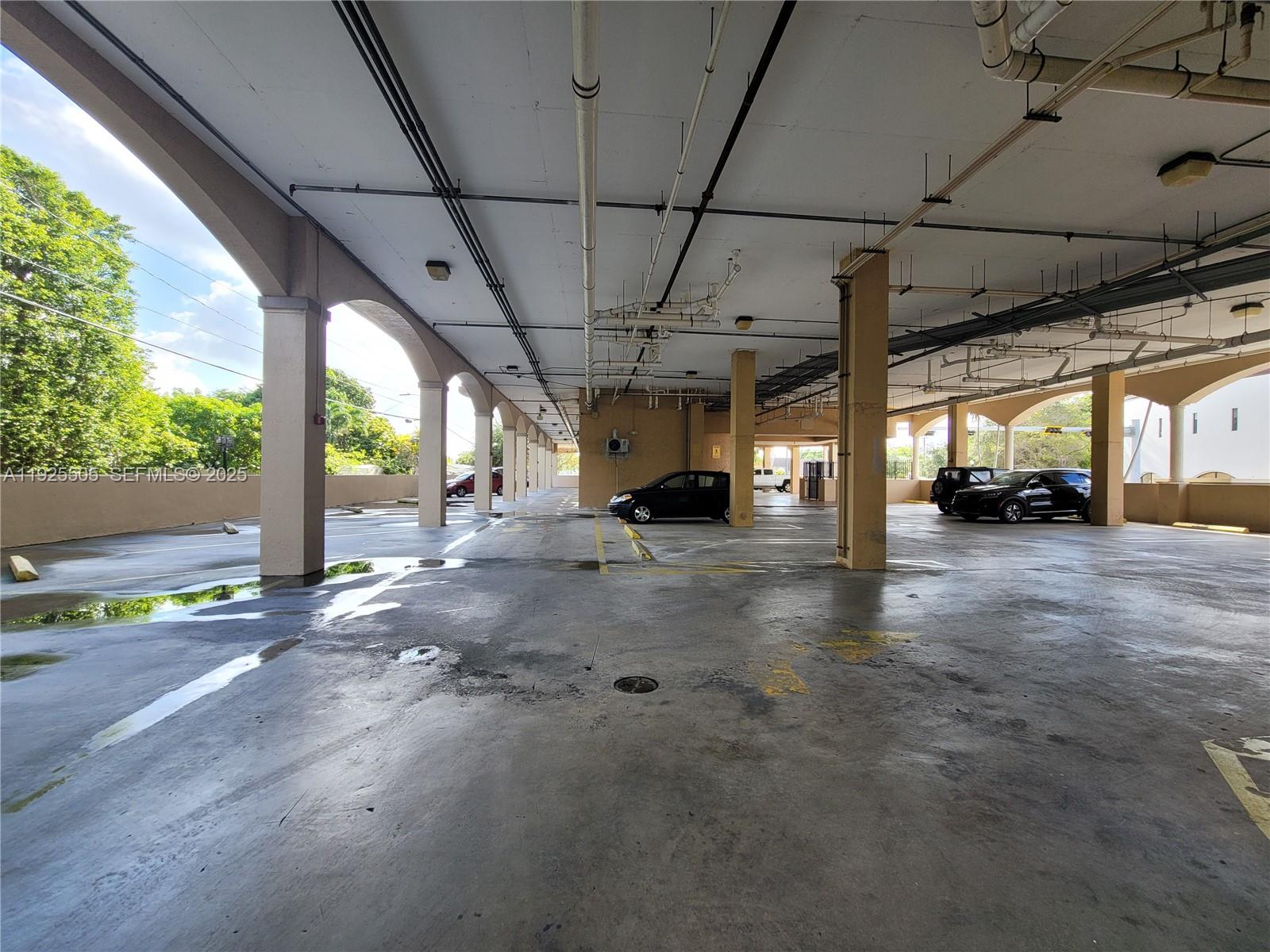 5271 Southwest 8th Street, Unit 411 Miami, FL 33134 - Photo 13 of 14 a view of parking area