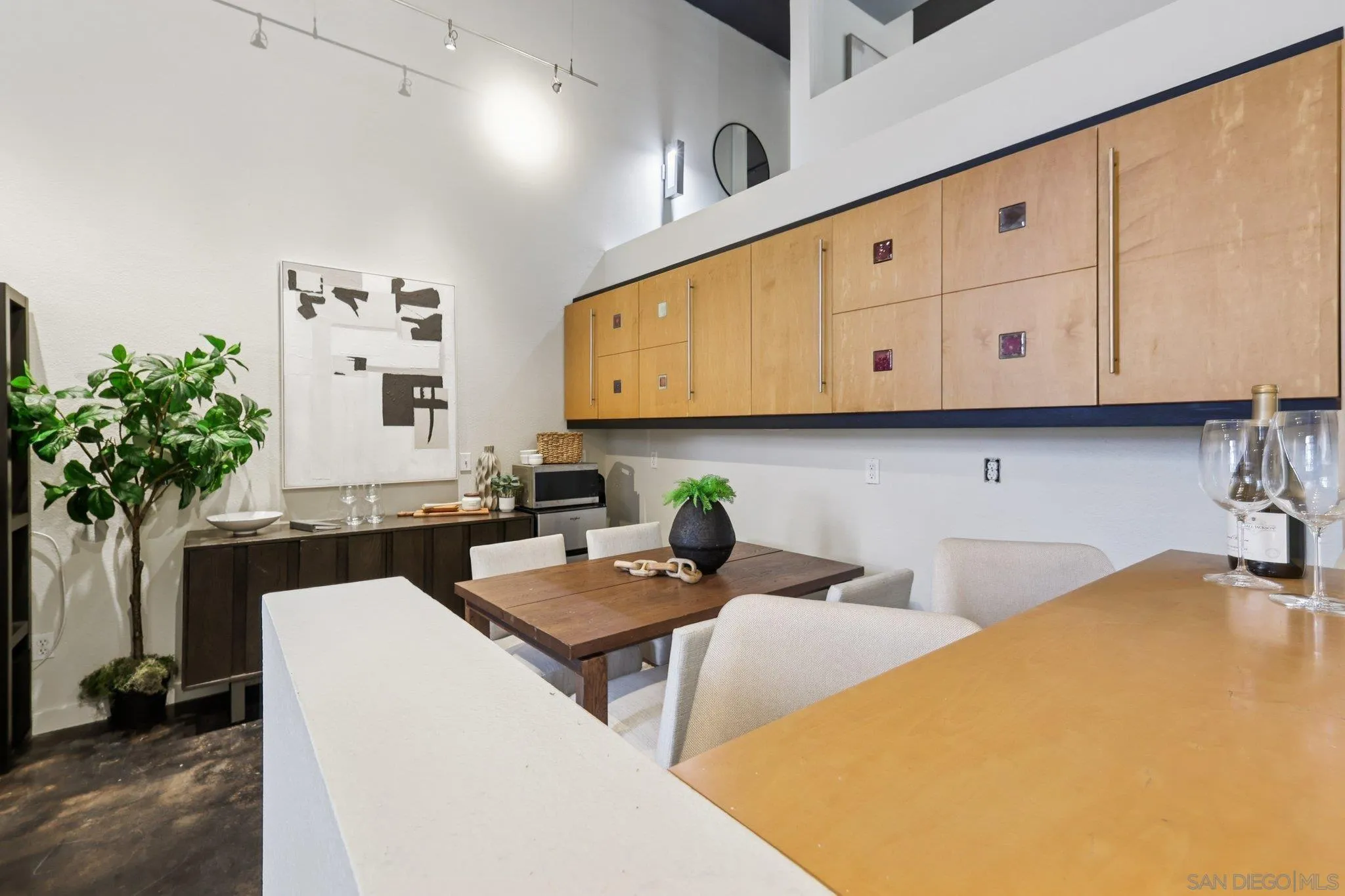 777 Sixth Avenue, Unit 135 San Diego, CA 92101 - Photo 13 of 38 a kitchen with stainless steel appliances granite countertop a sink a stove and white cabinets