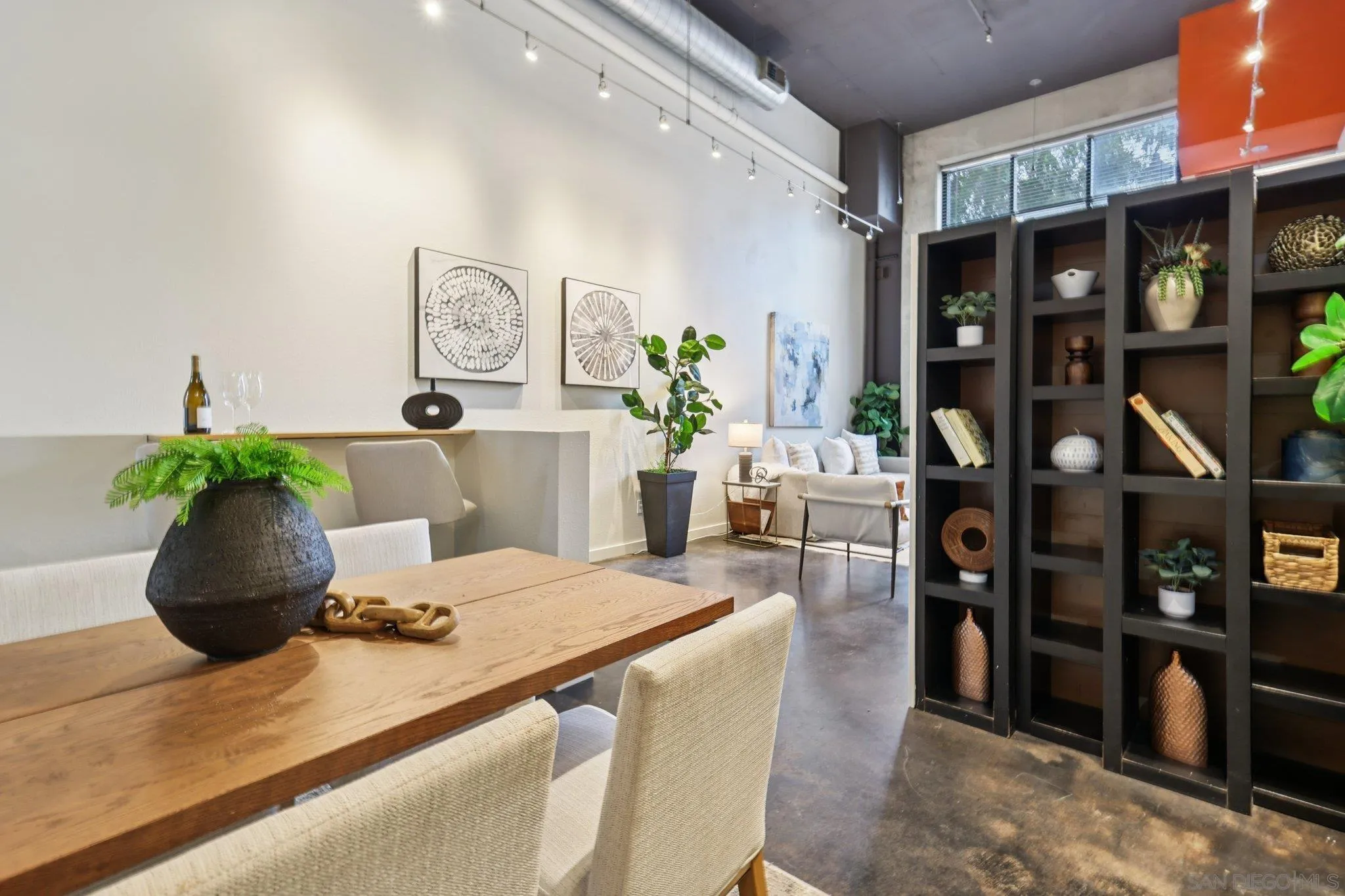 777 Sixth Avenue, Unit 135 San Diego, CA 92101 - Photo 16 of 38 a living room with furniture and potted plant
