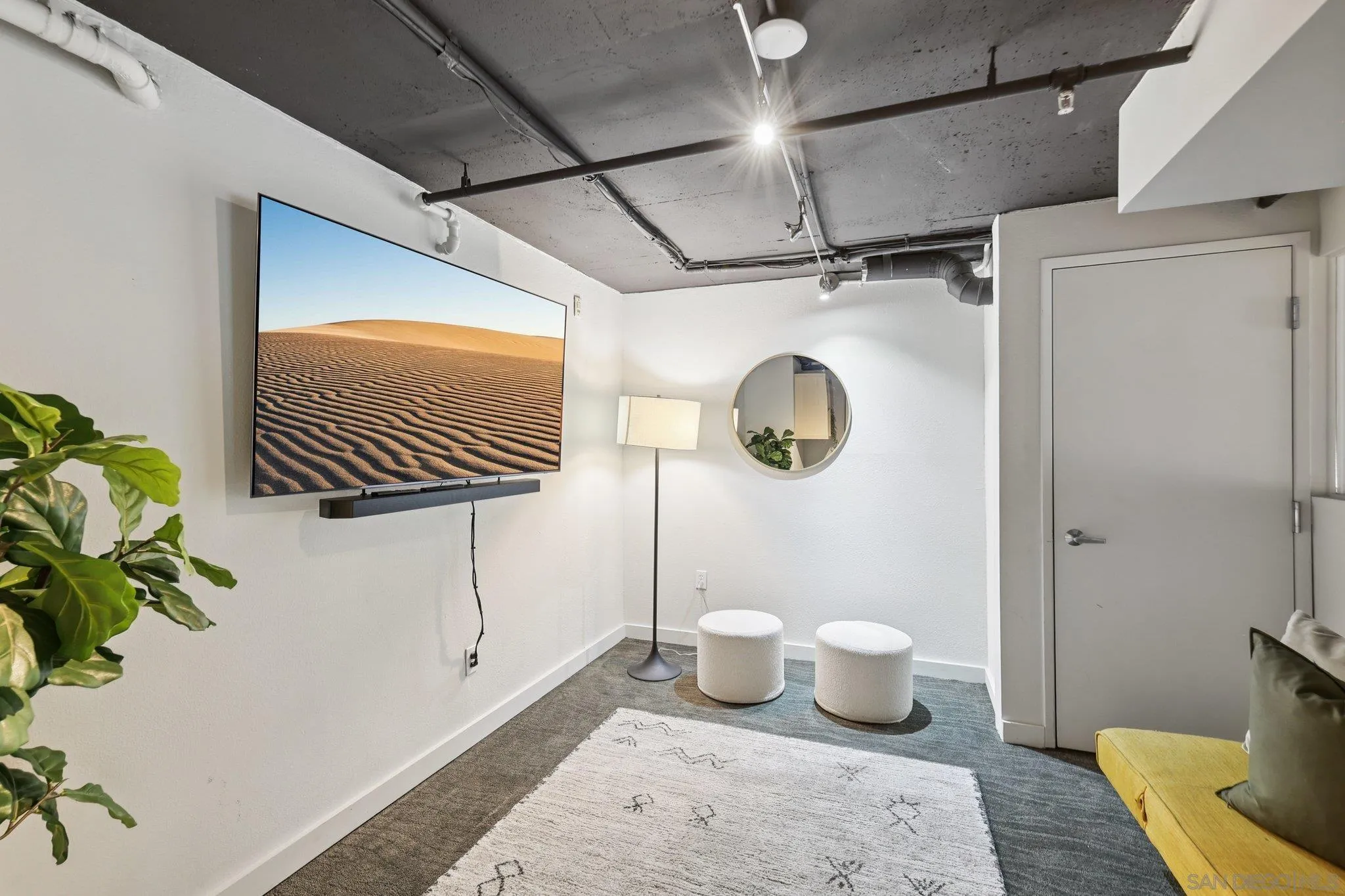 777 Sixth Avenue, Unit 135 San Diego, CA 92101 - Photo 18 of 38 a bathroom with a toilet and a mirror