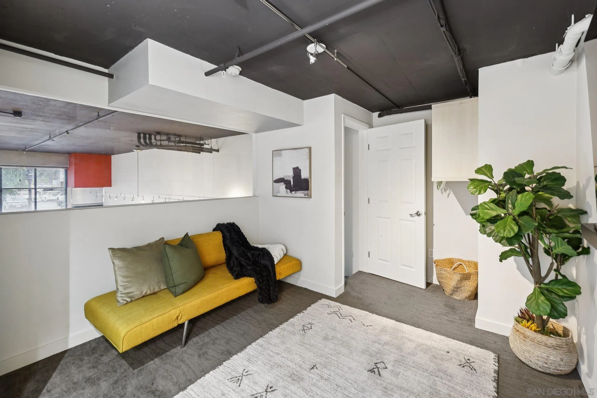 777 Sixth Avenue, Unit 135 San Diego, CA 92101 - Photo 20 of 38 a living room with furniture and a potted plant