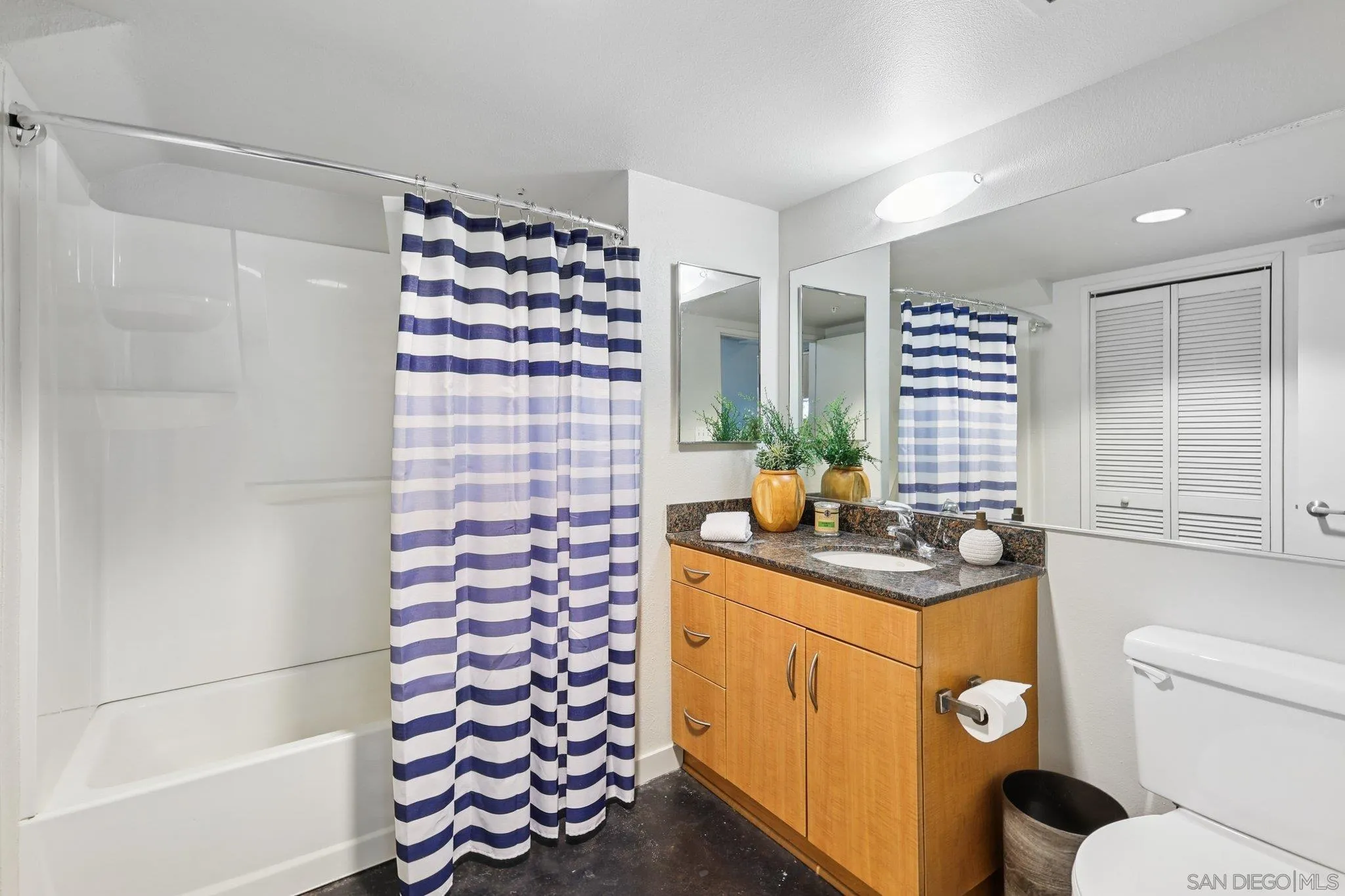 777 Sixth Avenue, Unit 135 San Diego, CA 92101 - Photo 23 of 38 a kitchen with a sink a stove and a window