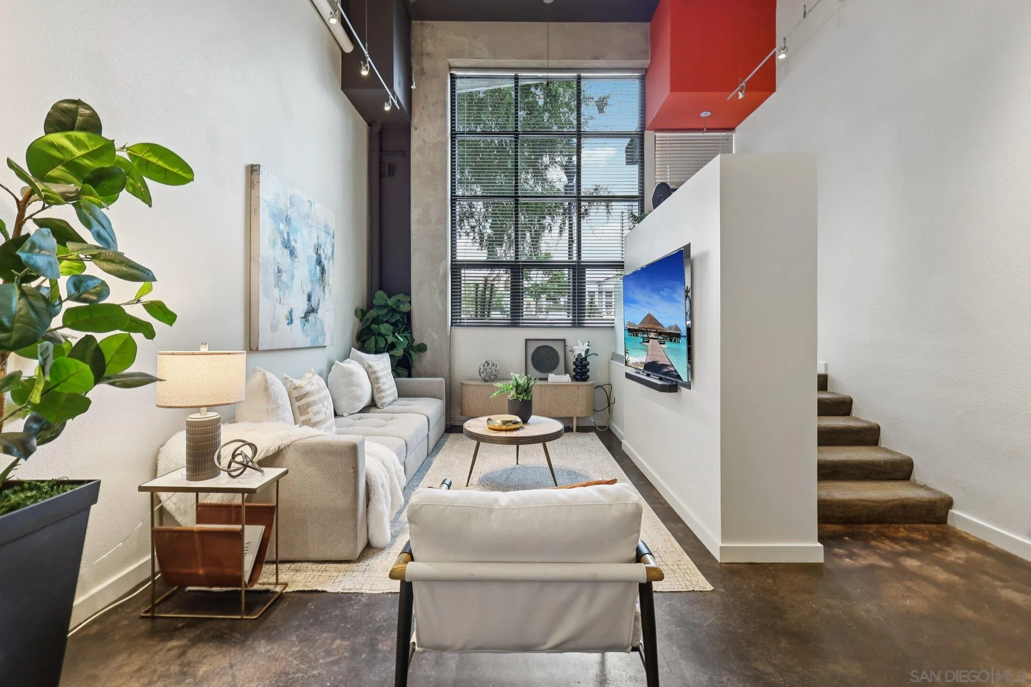777 Sixth Avenue, Unit 135 San Diego, CA 92101 - Photo 3 of 38 a living room with furniture and a potted plant