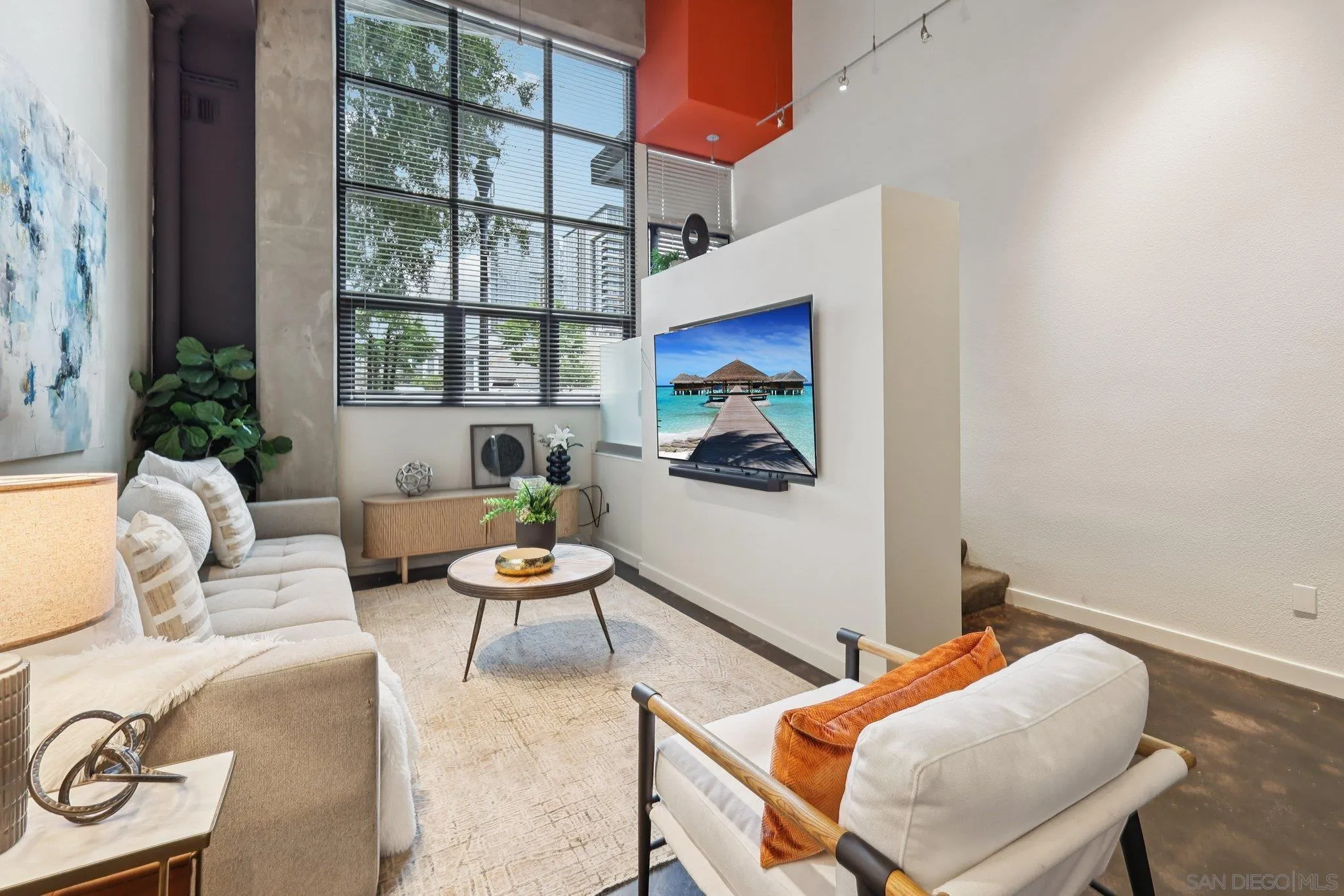 777 Sixth Avenue, Unit 135 San Diego, CA 92101 - Photo 6 of 38 a living room with furniture and a window