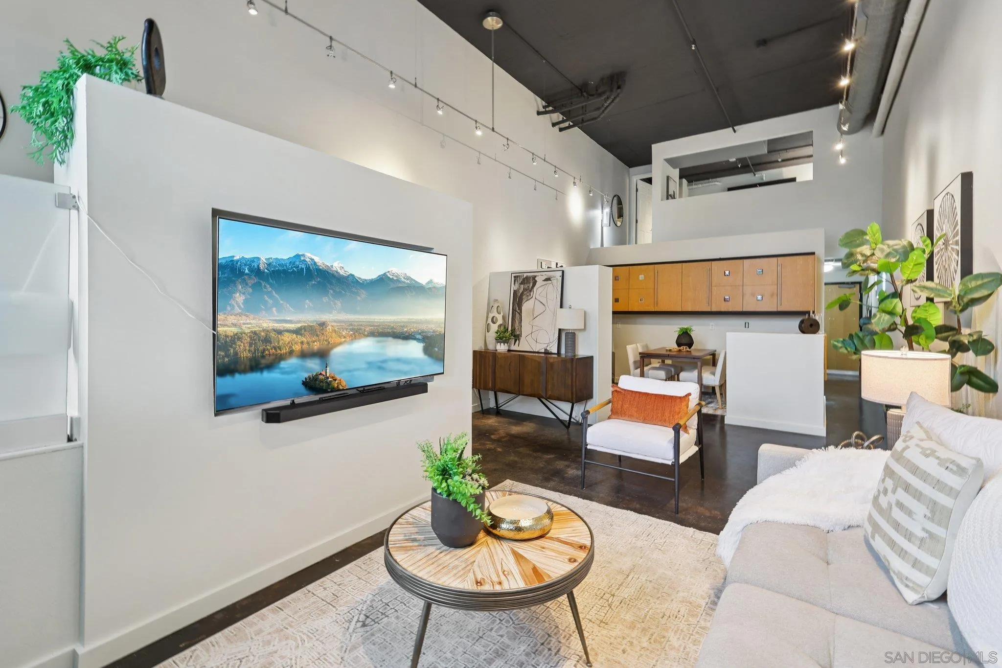 777 Sixth Avenue, Unit 135 San Diego, CA 92101 - Photo 9 of 38 a living room with furniture and a flat screen tv