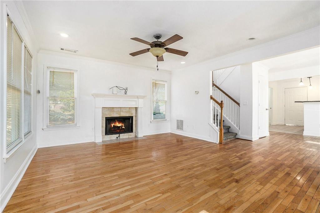 719 Magnolia Street Northwest Atlanta, GA 30314 - Photo 2 of 13 a view of a livingroom with a fireplace and a chandelier fan