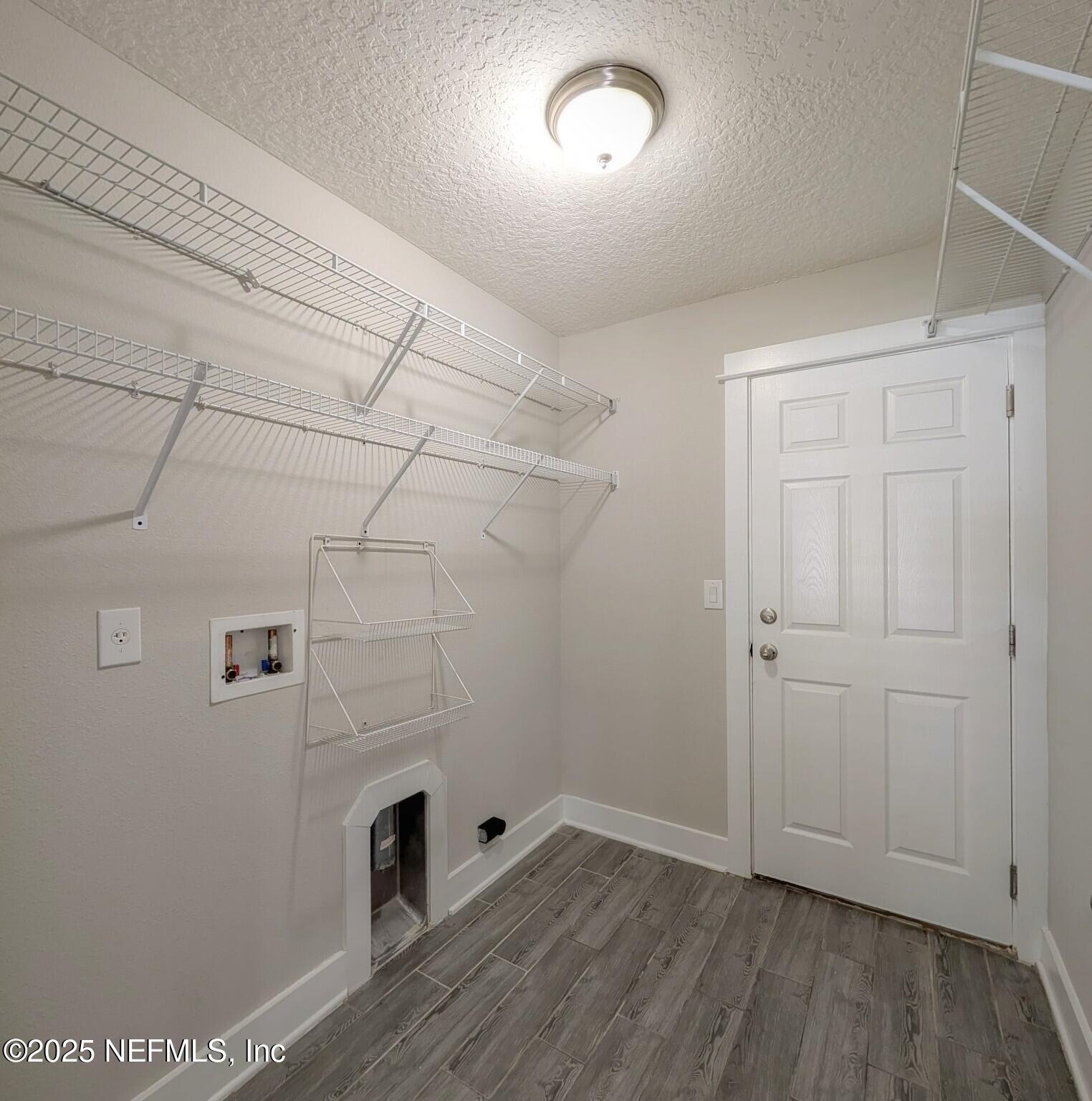 12950 Old St Augustine Road Jacksonville, FL 32258 - Photo 19 of 22 an empty room with wooden floor and white walls