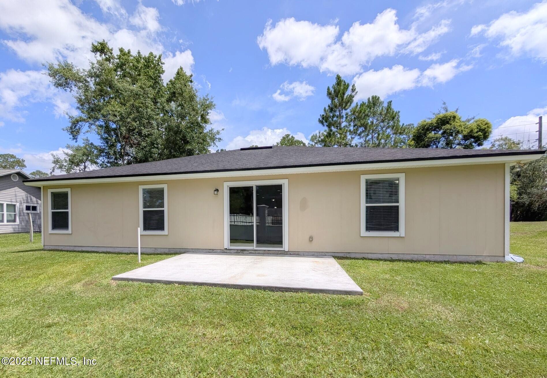 12950 Old St Augustine Road Jacksonville, FL 32258 - Photo 21 of 22 a backyard of a house with lots of green space