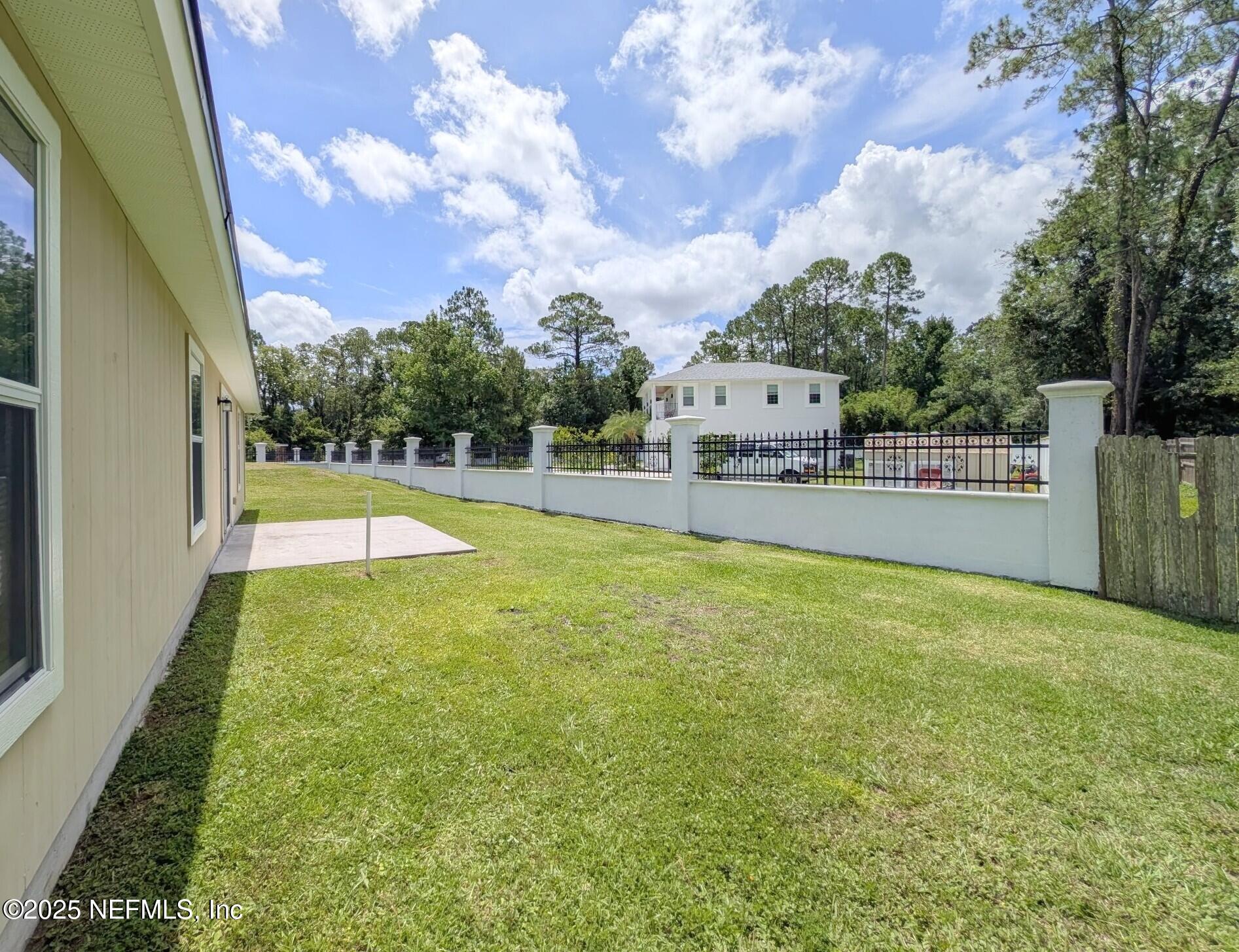 12950 Old St Augustine Road Jacksonville, FL 32258 - Photo 22 of 22 a view of a swimming pool with a yard