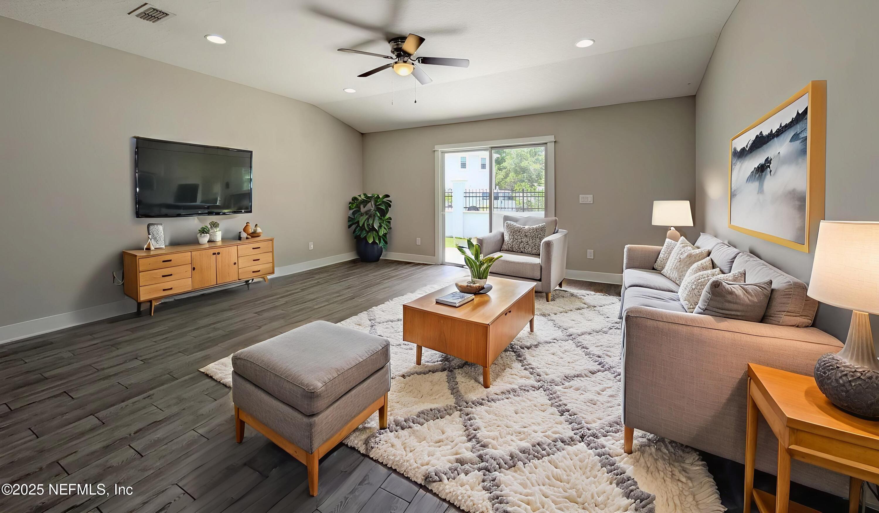 12950 Old St Augustine Road Jacksonville, FL 32258 - Photo 3 of 22 a living room with furniture and a flat screen tv