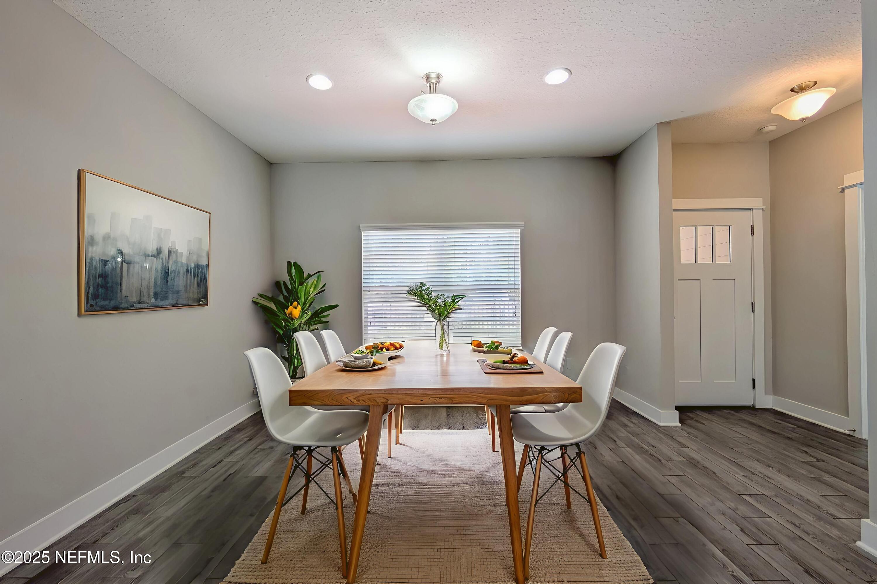 12950 Old St Augustine Road Jacksonville, FL 32258 - Photo 5 of 22 a view of a dining room with furniture and wooden floor