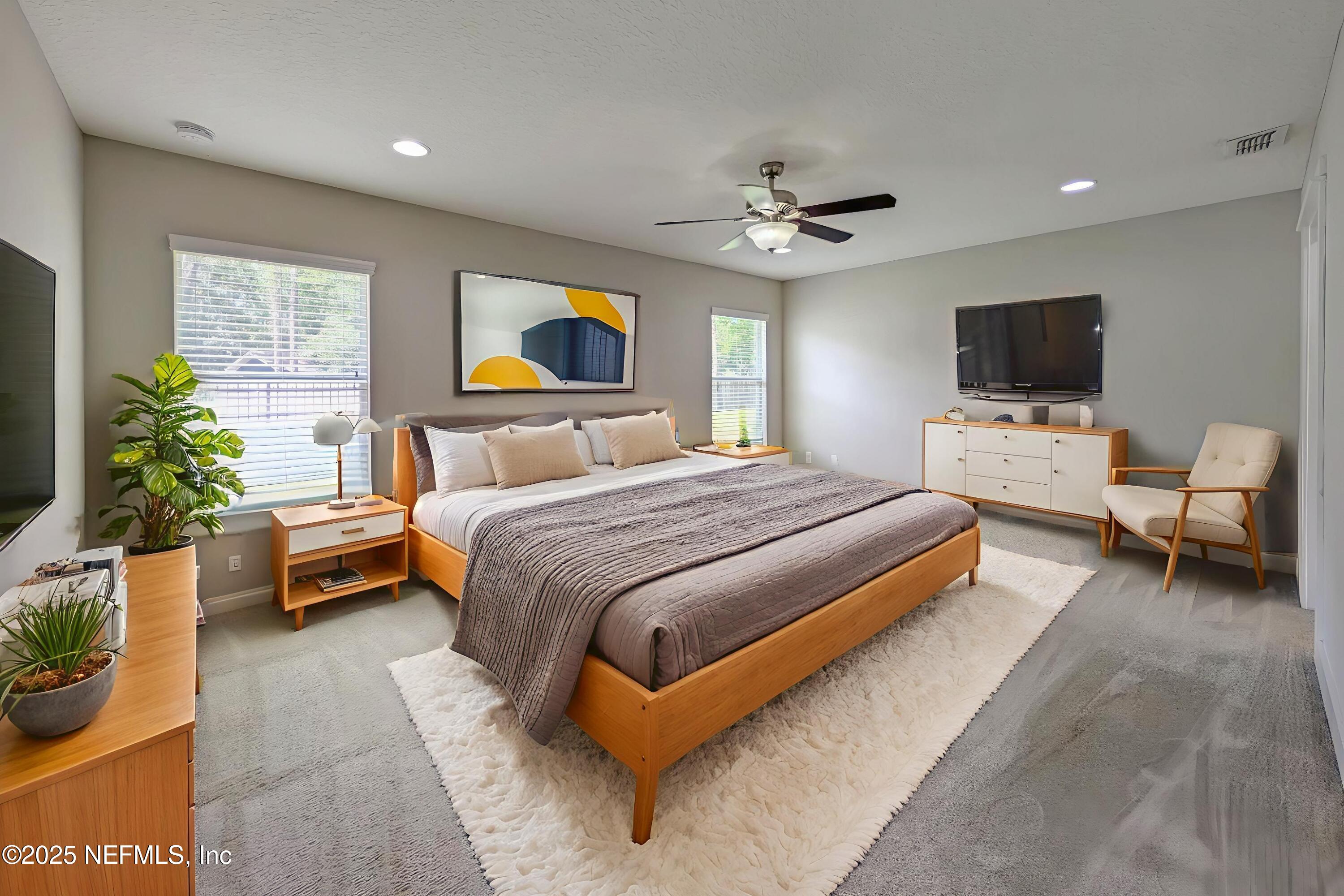 12950 Old St Augustine Road Jacksonville, FL 32258 - Photo 9 of 22 a bedroom with a bed and a flat screen tv