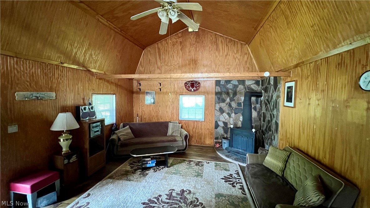 5017 Jade Road Northwest Carrollton, OH 44615 - Photo 9 of 22 Cozy cabin has great room w/woodburning stove.