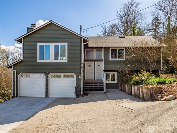 a front view of a house with a garage