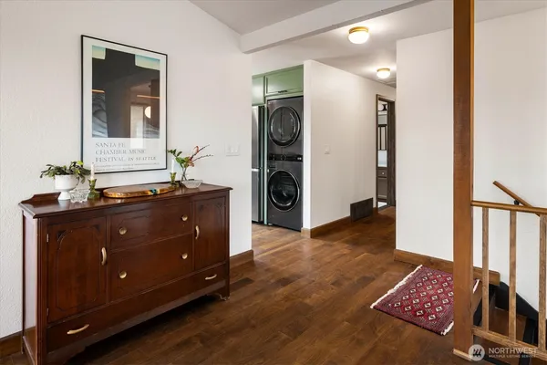 a room with a dresser and a mirror