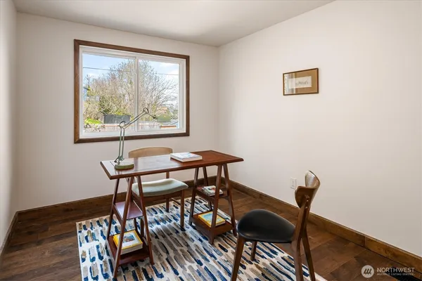 a view of a workspace and wooden floor