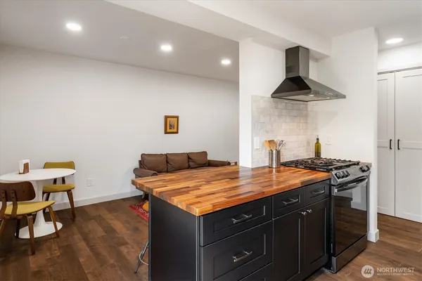 a kitchen with stainless steel appliances granite countertop a stove and a sink