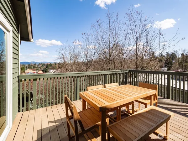 a view of a wooden deck with furniture