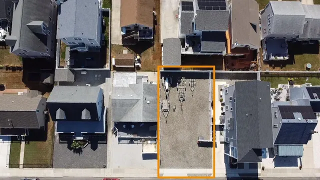 an aerial view of houses with outdoor space