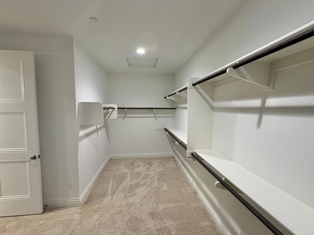 39529 Dayspring Way Temecula, CA 92591 - Photo 28 of 49 a view of a room with racks on the wall