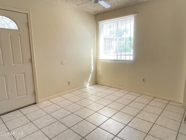 a view of an empty room and window