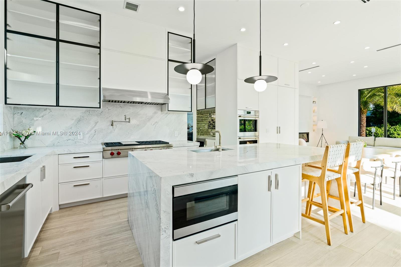 9000 Abbott Avenue Surfside, FL 33154 - Photo 12 of 82 a kitchen with stainless steel appliances kitchen island granite countertop a stove a sink and a refrigerator