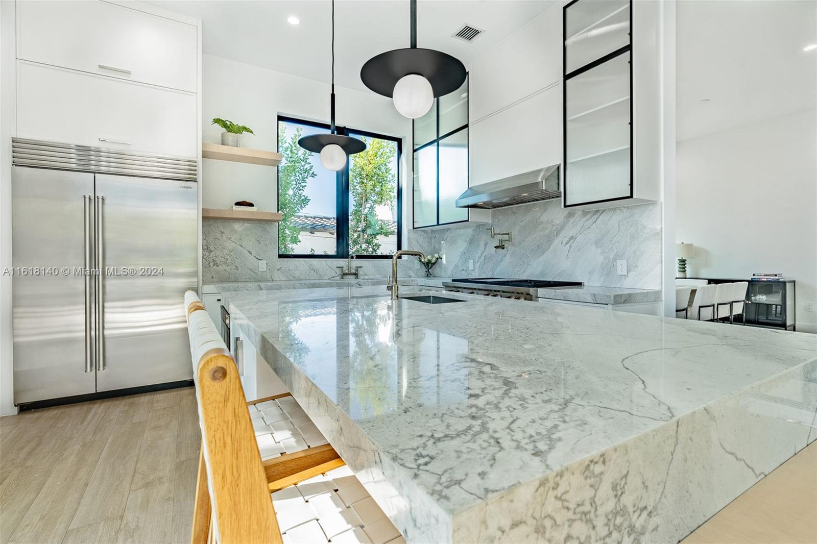 9000 Abbott Avenue Surfside, FL 33154 - Photo 13 of 82 a kitchen with stainless steel appliances granite countertop a sink and a granite counter tops