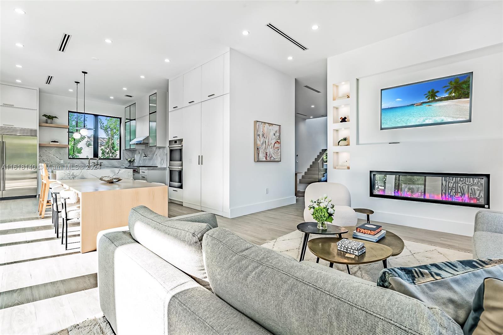 9000 Abbott Avenue Surfside, FL 33154 - Photo 18 of 82 a living room with furniture and a view of kitchen