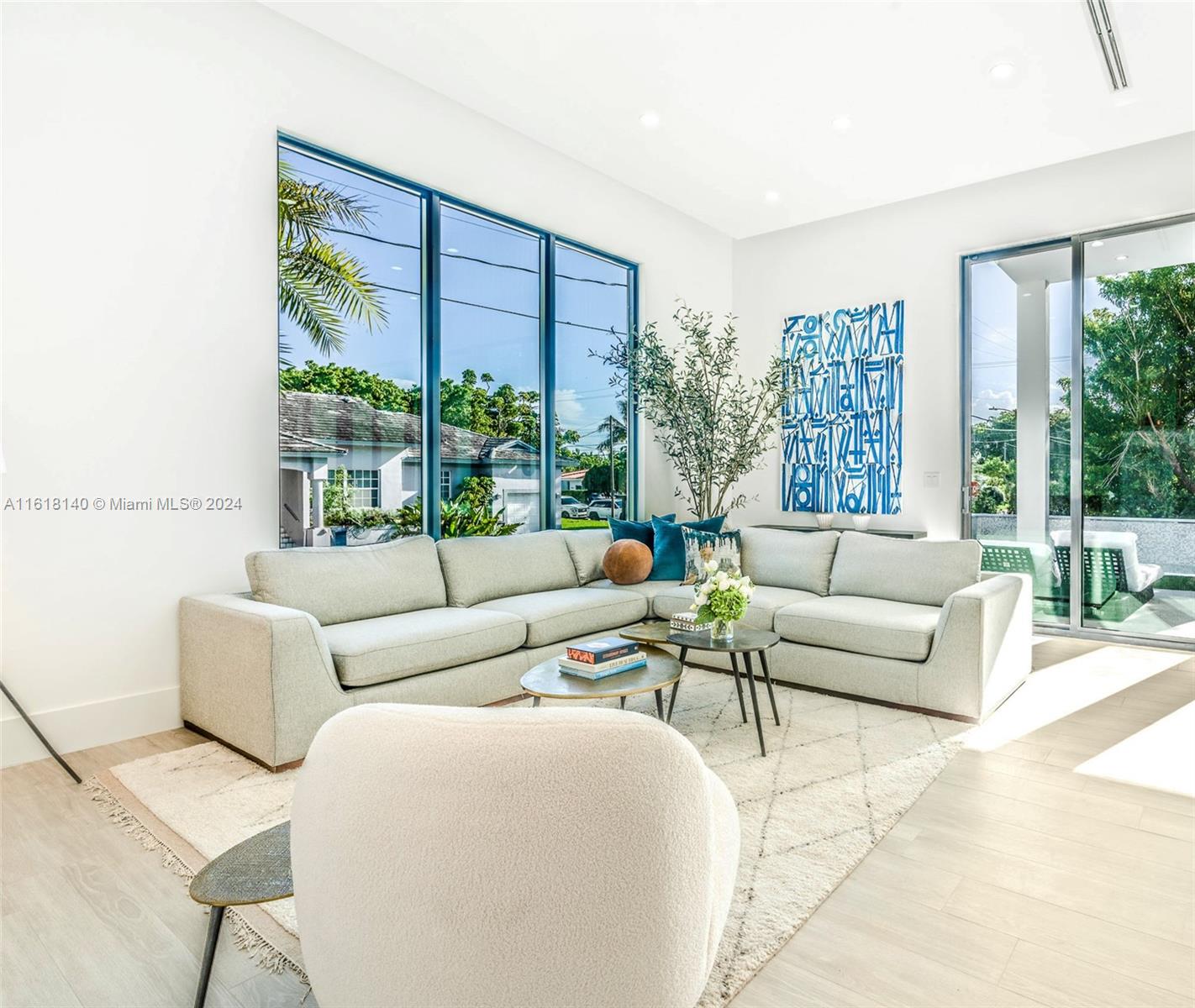 9000 Abbott Avenue Surfside, FL 33154 - Photo 22 of 82 a living room with furniture and a large window
