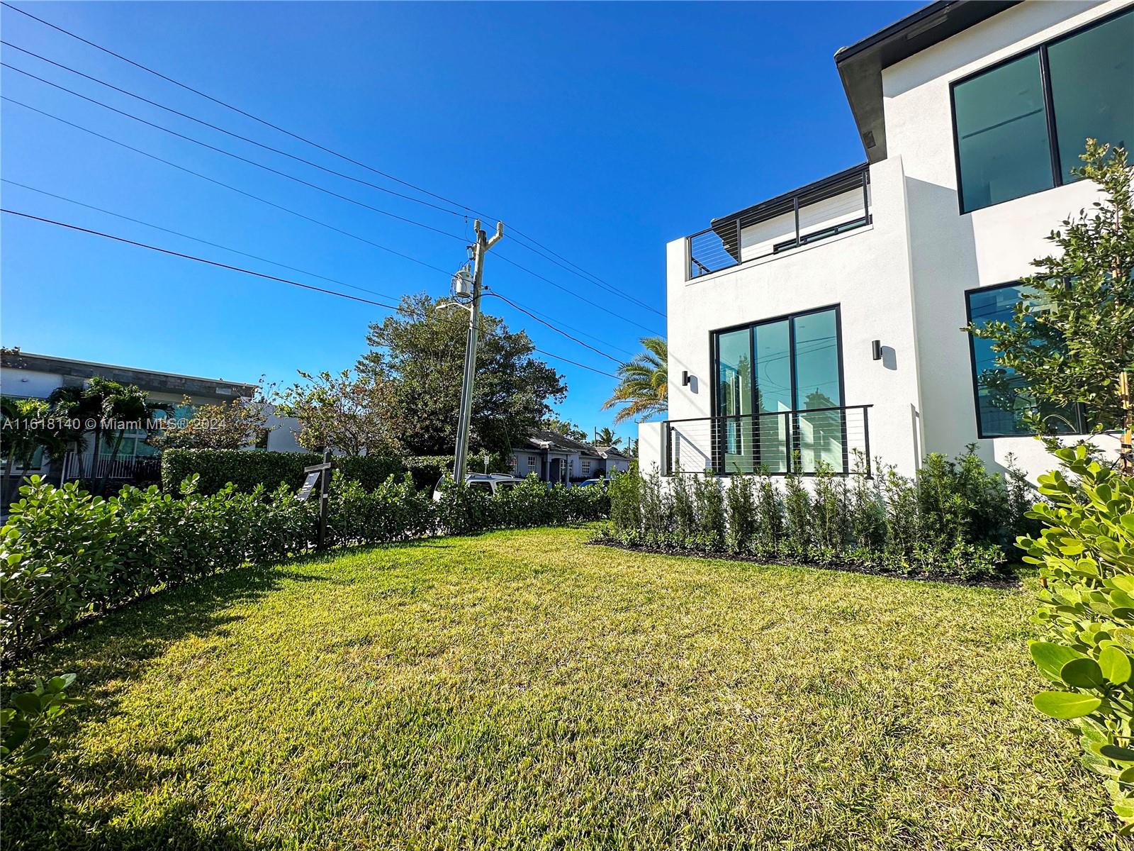 9000 Abbott Avenue Surfside, FL 33154 - Photo 38 of 82 a view of a house with a yard