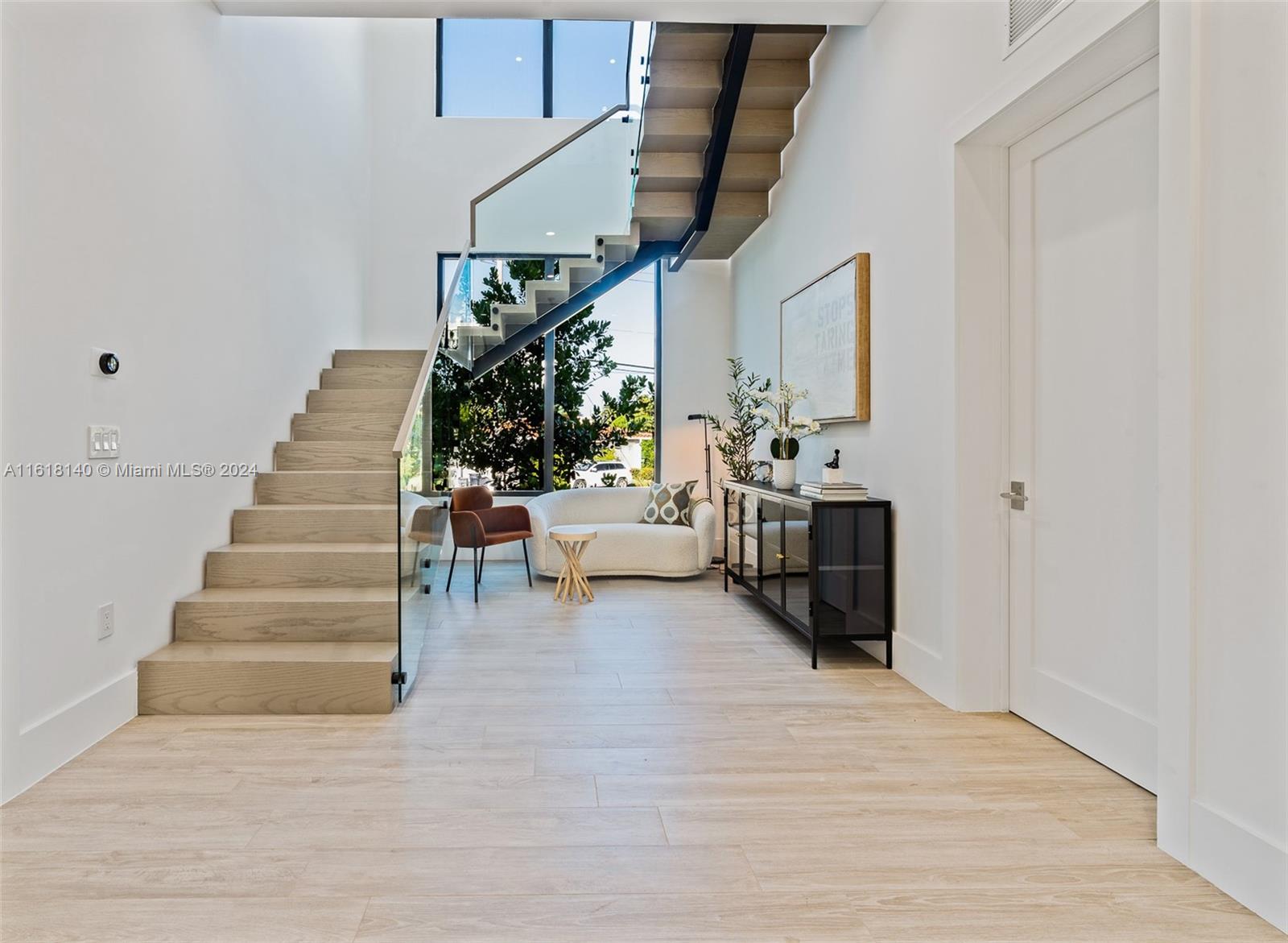 9000 Abbott Avenue Surfside, FL 33154 - Photo 45 of 82 a living room with furniture and stairs