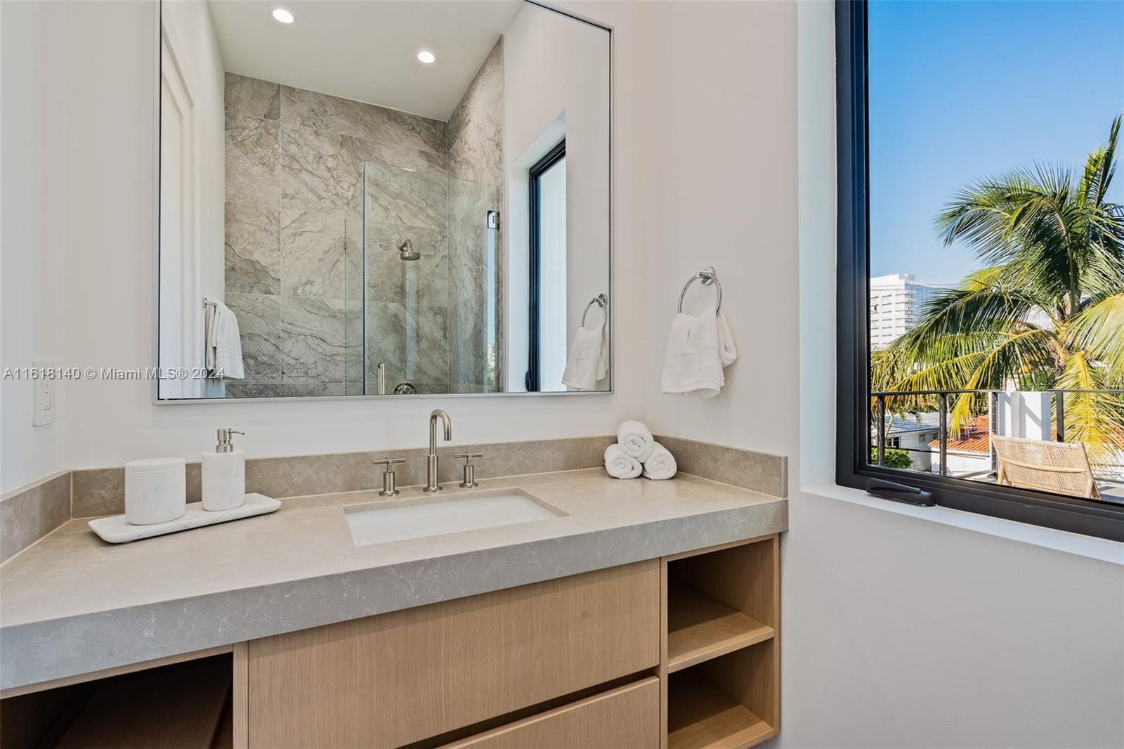 9000 Abbott Avenue Surfside, FL 33154 - Photo 52 of 82 a bathroom with a sink double vanity and a mirror