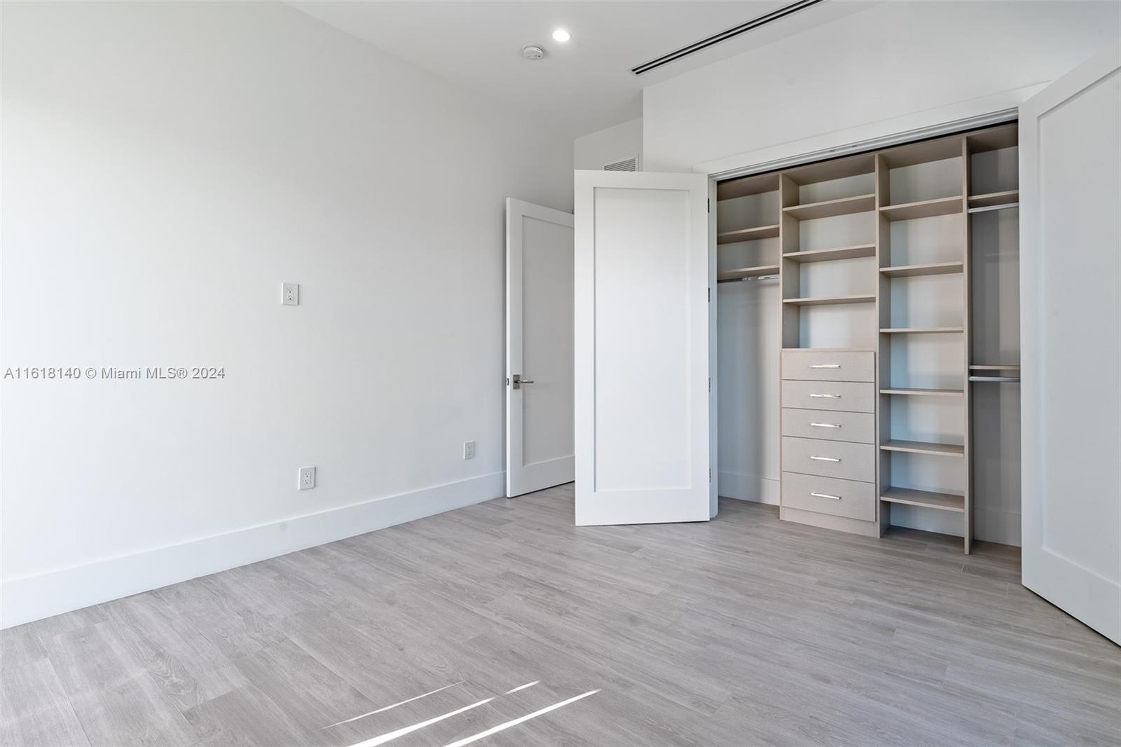 9000 Abbott Avenue Surfside, FL 33154 - Photo 64 of 82 a view of walk in closet with empty racks