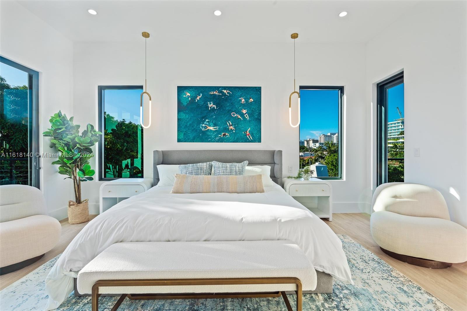 9000 Abbott Avenue Surfside, FL 33154 - Photo 66 of 82 a bedroom with a large bed and windows