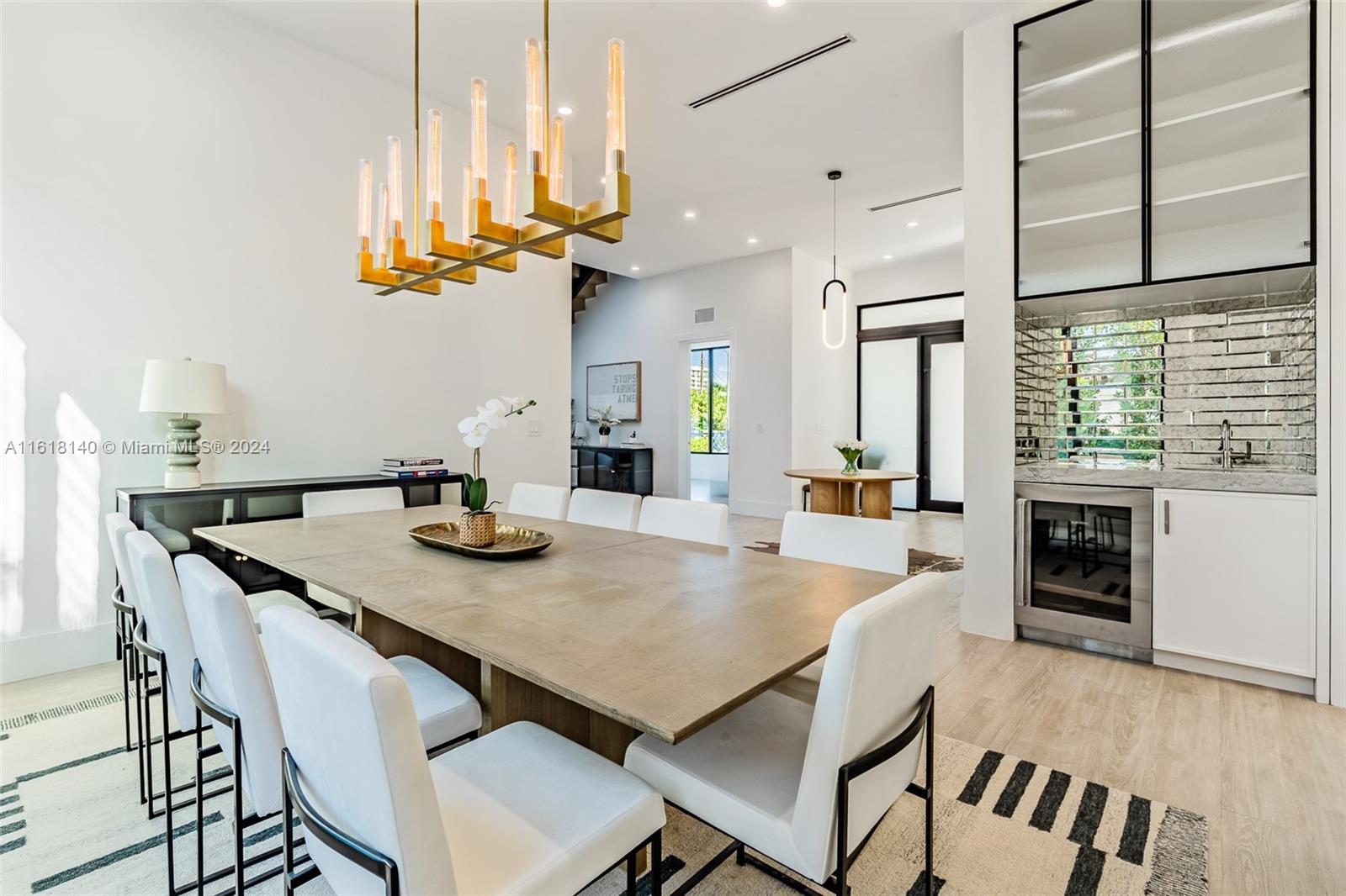9000 Abbott Avenue Surfside, FL 33154 - Photo 10 of 82 a view of a dining room kitchen island and stainless steel appliances