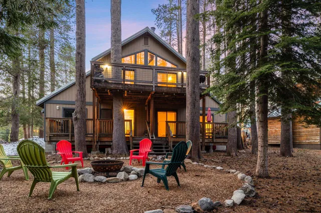 a view of a chairs and tables in the back yard of the house