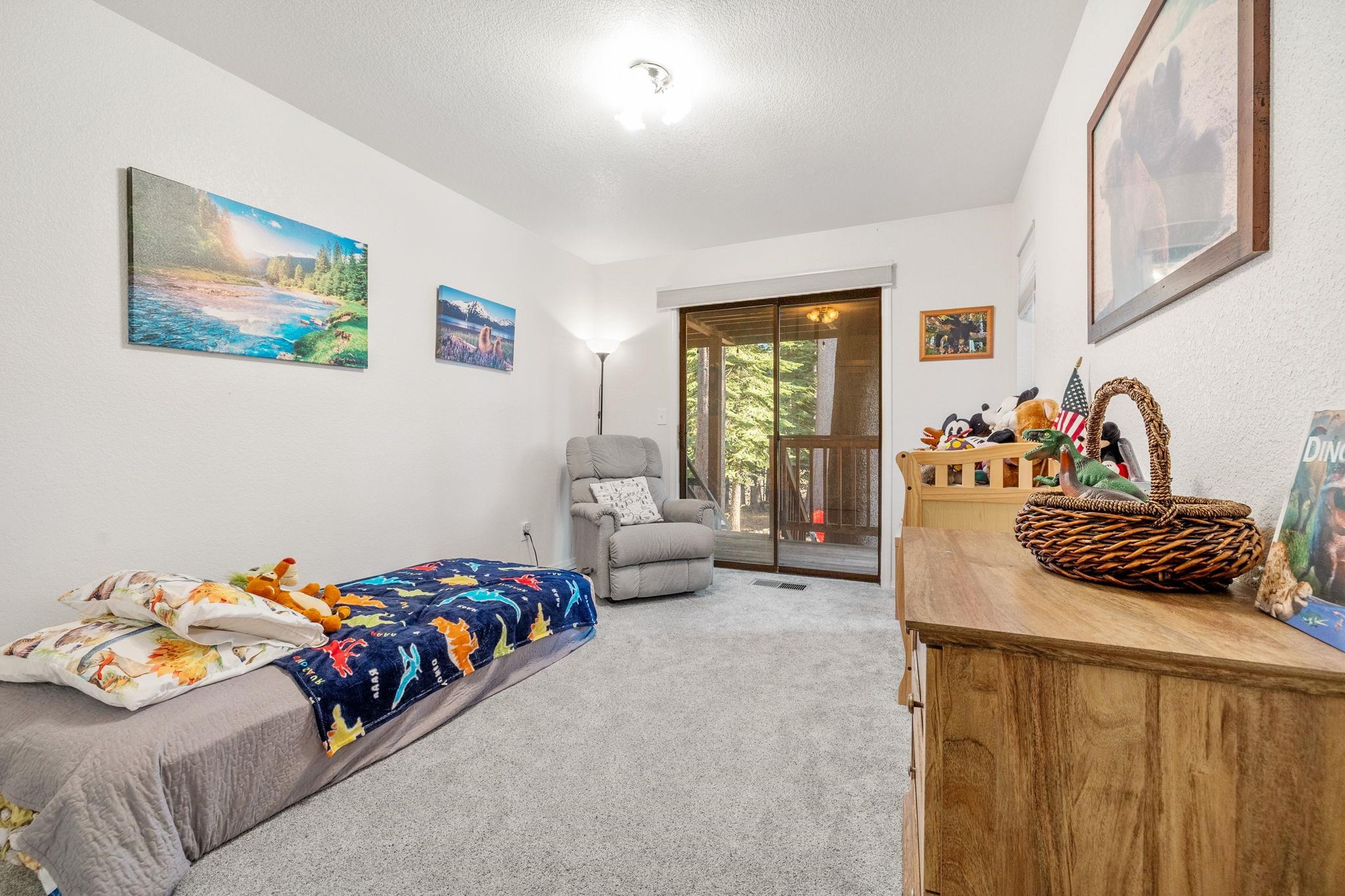 50689 Conifer Drive Soda Springs, CA 95728 - Photo 12 of 28 a bedroom with a bed and a couch