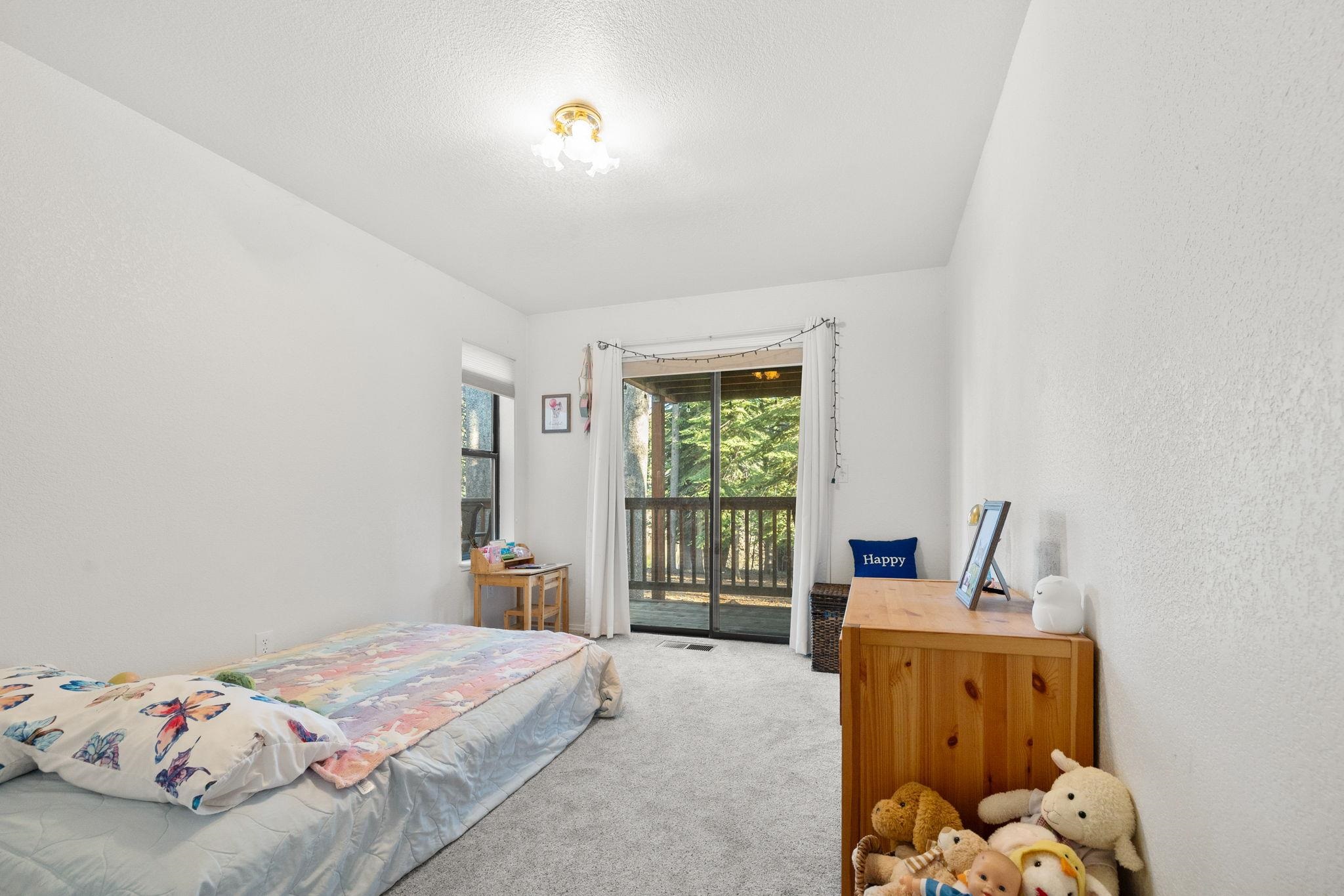 50689 Conifer Drive Soda Springs, CA 95728 - Photo 13 of 28 a bedroom with a bed and a window