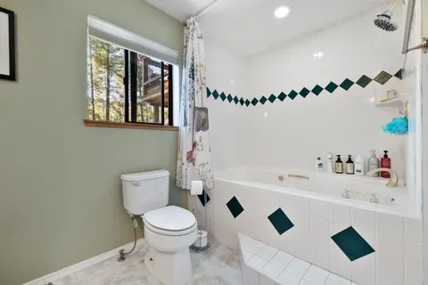a bathroom with a toilet a sink and a bathtub